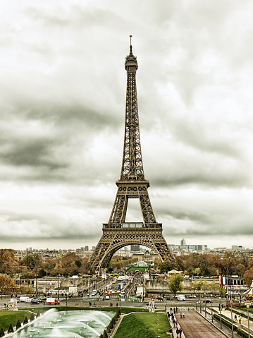 Paris, France-November 13, 2015: Paris cityscape with Eiffel tower in Paris, France. It is an iron tower named after engineer Gustave Eiffel, popular tourist attraction. Filtered image