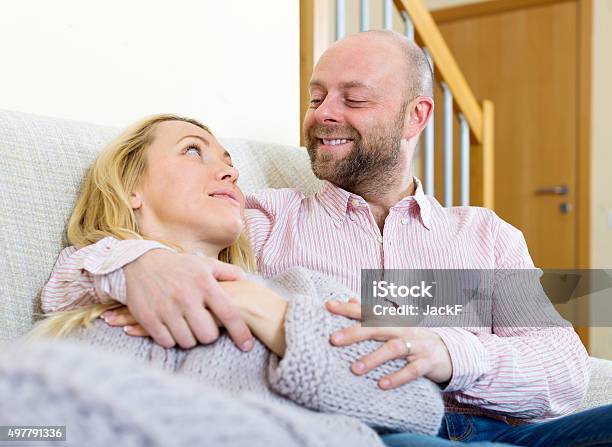 Loving Couple In Home Interior Stock Photo - Download Image Now - 2015, 30-39 Years, Adult