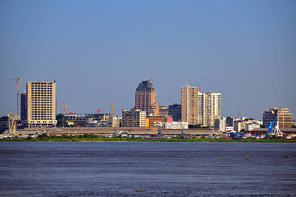 Kinshasa central business district, Congo, skyline Kinshasa, Democratic Republic of the Congo: business district skyline and the Congo river - sky with copy space - photo by M.Torres kinshasa stock pictures, royalty-free photos & images