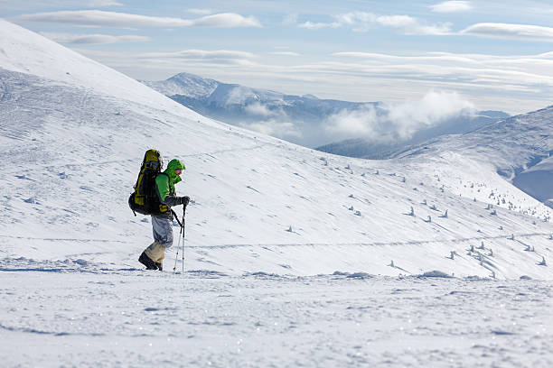 istock Hiker walking in winter Carpathian mountains 497792102