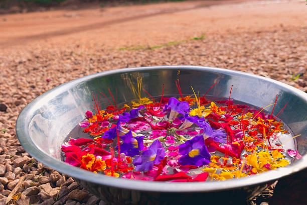 A beautiful earthen bowl full of fresh flowers in water in Bagan.