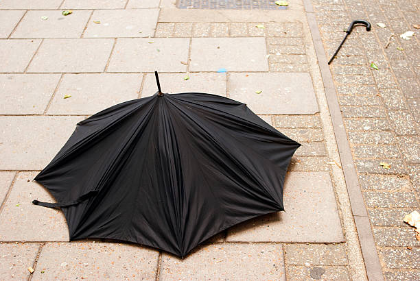 istock Broken Umbrella on the pavement,Bad weather. 497792688