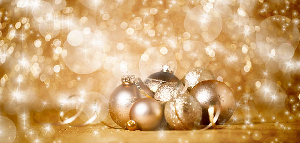 istock Gold Christmas Baubles with Ribbon and Defocused Lights 497793298