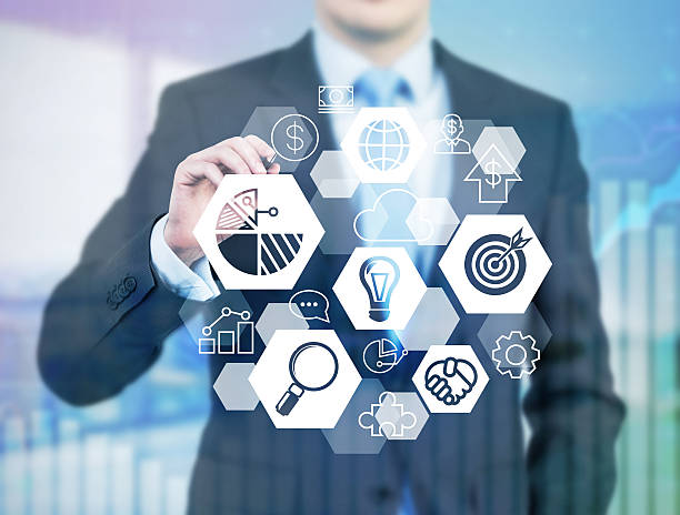 istock businessman in formal suit is drawing a business icon 497793326