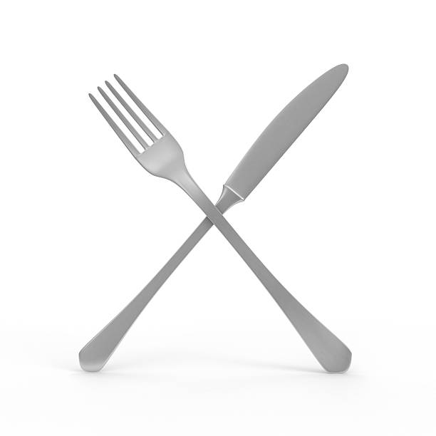 istock Silver Knife and Fork Crossed isolated on white background 497794437