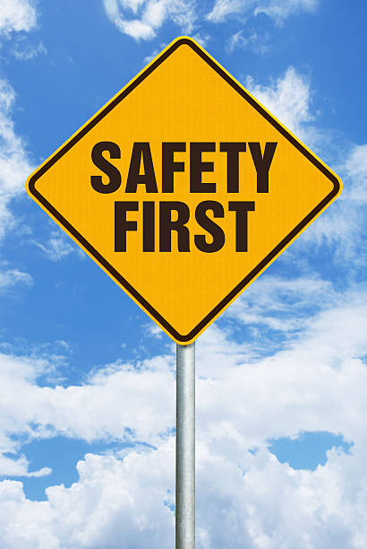 istock Safety First - Warning Sign Against Blue Sky with Clouds 497795651