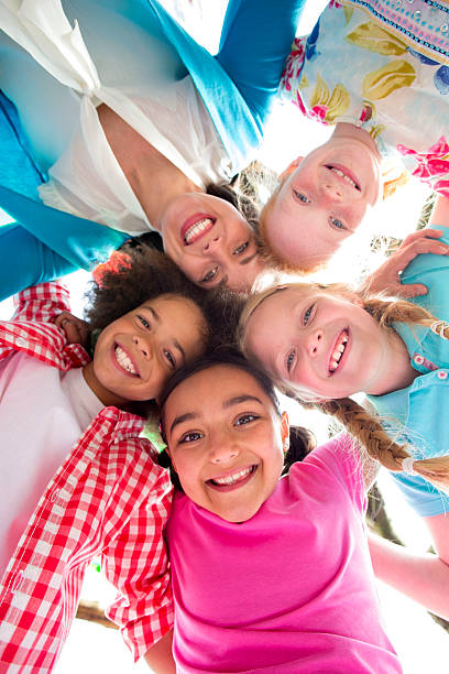 istock Happy with Heads Together Looking Down Smiling 497795963