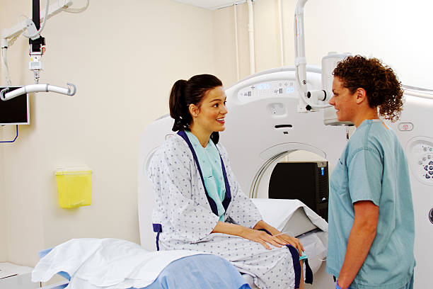 istock Technician giving patient instructions for ultrasound 497796661