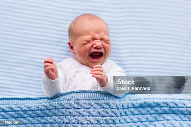 Newborn Baby Boy On A Blue Blanket Stock Photo - Download Image Now - Crying, Baby - Human Age, Newborn