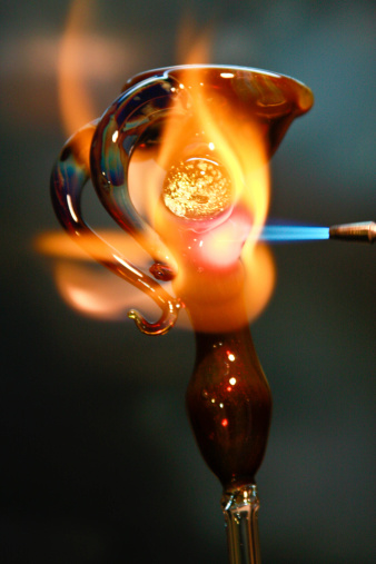 A hand made piece of glass under the torches fire