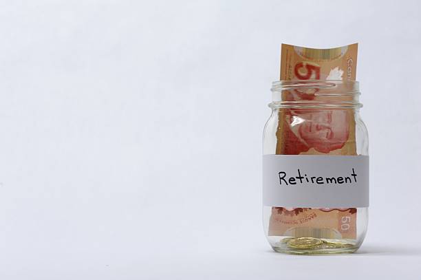 istock Retirement Savings Jar With Coins And Banknotes 497801594