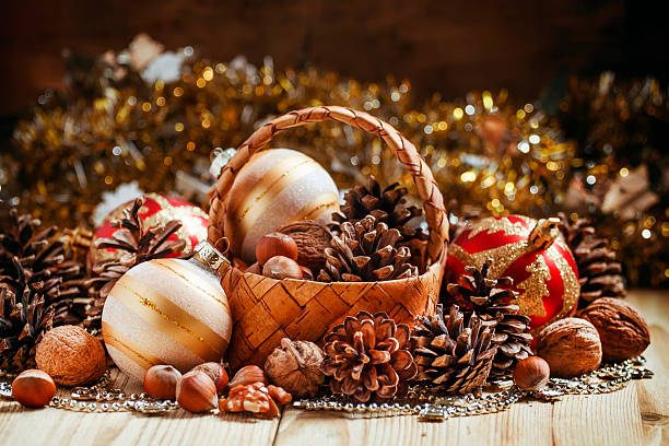 istock Wicker basket with fir cones, nuts, Christmas balls 497802024