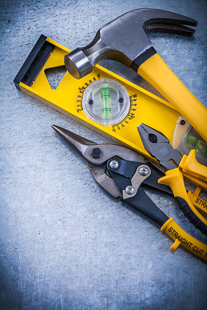 istock Construction level claw hammer steel cutter pliers on metallic b 497804158