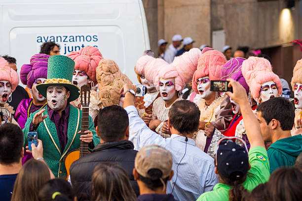 Montevideo, Uruguay - January 25, 2013: People crowding and taking photos of the performers during the 2013 Inaugural Parade of the Uruguayan carnival along Avenida 18 de Julio in Montevideo, Uruguay