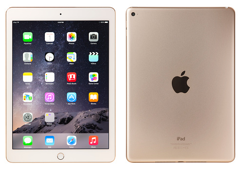 Belen, New Mexico, USA - November 1, 2014: A gold Wi-Fi iPad Air 2 with iOS 8.1 by Apple Inc. Announced on October 16, 2014, the iPad Air 2 is now just 6.1 mm thin and weighs less than a pound, It also features an improved Retina display, improved cameras, and Touch ID.