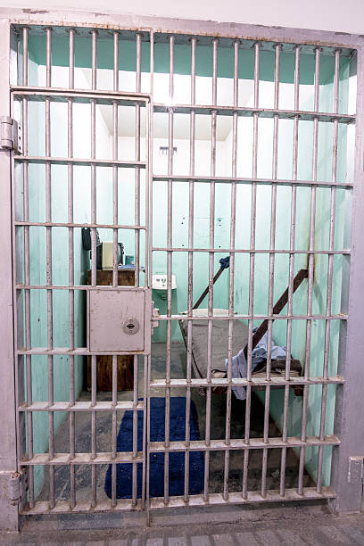 istock Jail cell bars and living quarters 497807392