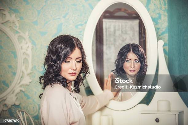 Beautiful Woman In The Mirror Reflected The Smiles Magically Stock Photo - Download Image Now