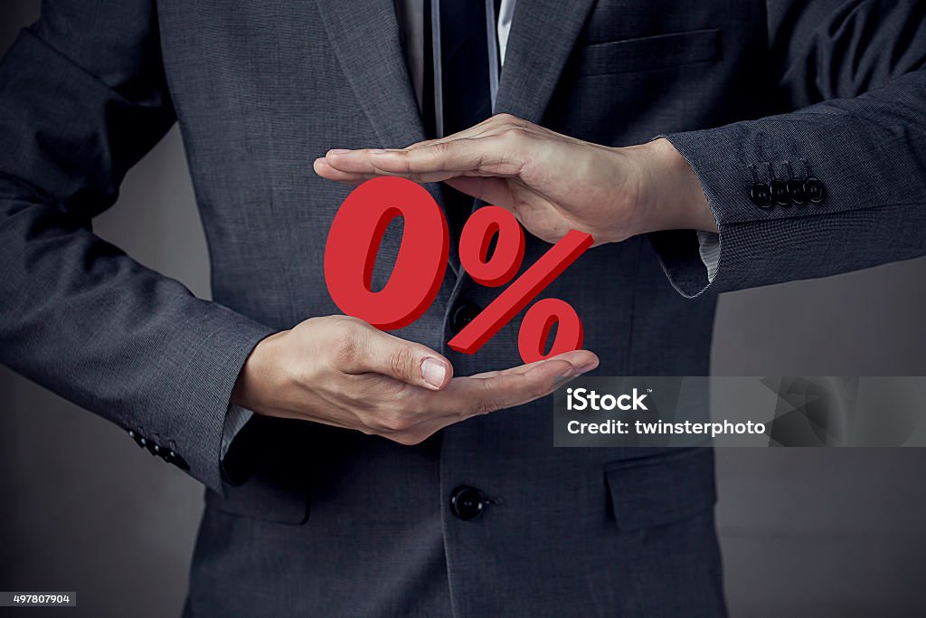 Business man Presenting Zero Percent, indicating zero interest a Business man Presenting Zero Percent, indicating zero interest and other financial percentage Zero Stock Photo