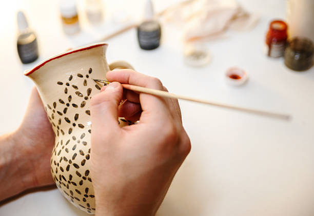Pottery. Painting pottery. Pottery. Man is painting pottery. pottery photos stock pictures, royalty-free photos & images
