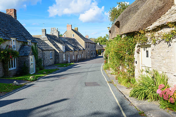 istock Summers day in typical English village 497809850