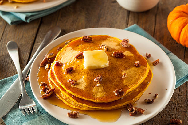 istock Homemade Pumpkin Pancakes with Butter 497810362