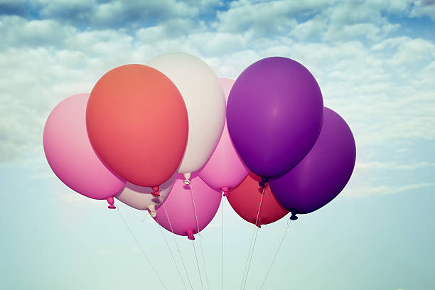 istock Colorful balloons on blue sky background 497810462