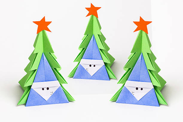 istock Christmas tree on white isolated origami. 497810810