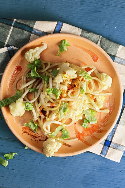 Pasta with cauliflower on plate above view stock photo