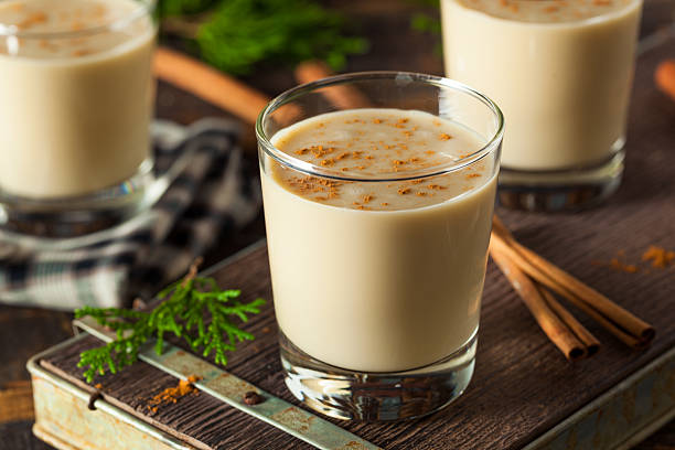 Cold Refreshing Eggnog Drink Cold Refreshing Eggnog Drink for the Holidays spiked photos stock pictures, royalty-free photos & images