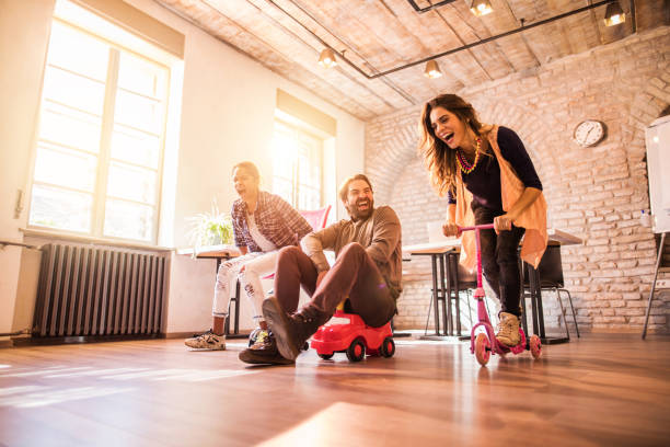 istock Childish business people having fun in the office. 497814444