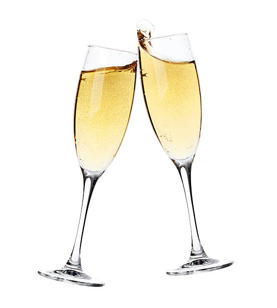 Cheers! Two champagne glasses Cheers! Two champagne glasses. Isolated on white background toasted stock pictures, royalty-free photos & images