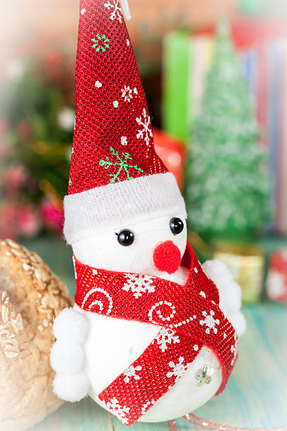 istock Christmas composition with small snowman and flower 497815568
