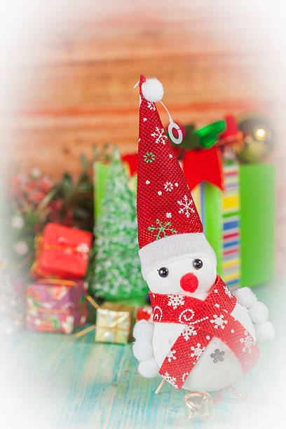 istock Christmas composition with small snowman and flower 497815654