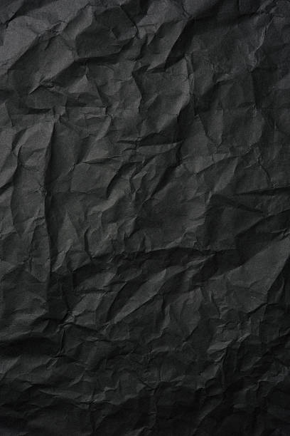 istock Crumpled black rice paper background 497815776