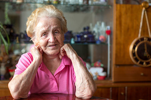 istock An elderly woman was sitting at the table in room. 497825744