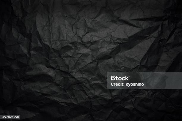 Crumpled Black Rice Paper Background With Spotlight Stock Photo - Download Image Now