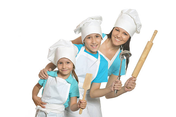 istock Smiling female chef with assistants 497828580