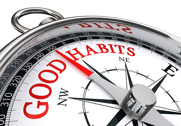 good habits red message on conceptual compass stock photo