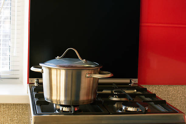 istock stainless saucepan on a gas stove 497829296