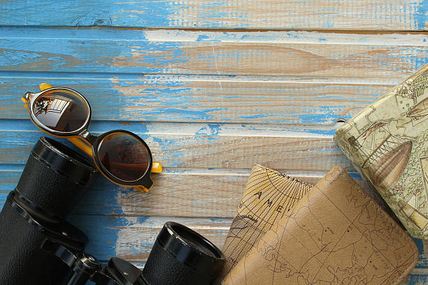 istock Travel background - binoculars, sunglasses, box and notebooks 497829454