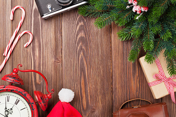istock Christmas background with camera, alarm clock and tree branch 497829848