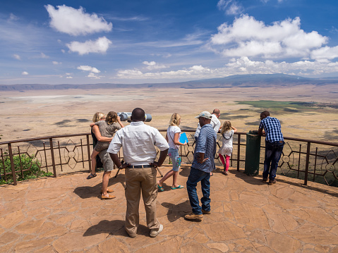 Ngorongoro Crater, Tanzania - October 14, 2015: People at the viewing point on the rim of Ngorongoro Crater, Tanzania, Africa looking at the crater on a normal day.