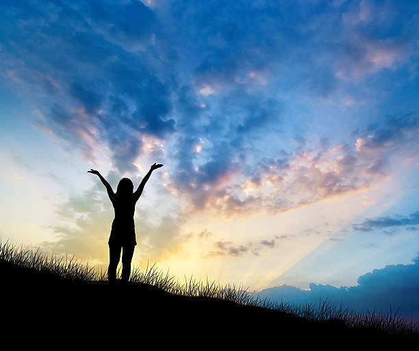 istock woman on hill and sky 497833564