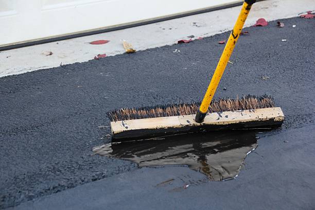 istock Asphalt Driveway sealing with brush 497833716
