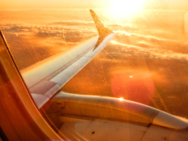 istock Sunlight from the porthole on airplane 497834492