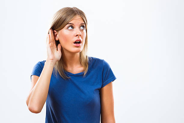 I am listening what you have to say! Cute blonde woman is listening what you got to say. hands covering ears stock pictures, royalty-free photos & images