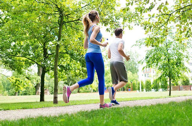 istock Couple jogging in the park 497835910