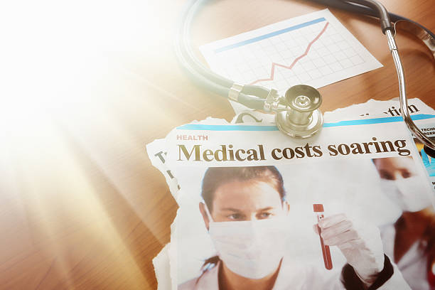 istock Article warning of soaring medical costs, with stethoscope 497836254