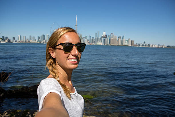 istock Tourist in Toronto taking personal perspective selfie portrait 497839496