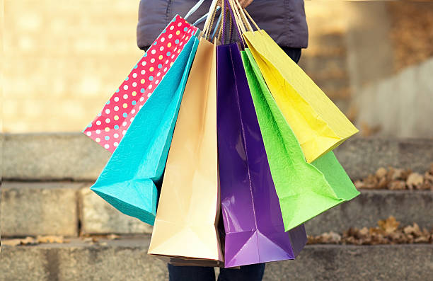 istock colorful shopping bags in hand 497839884